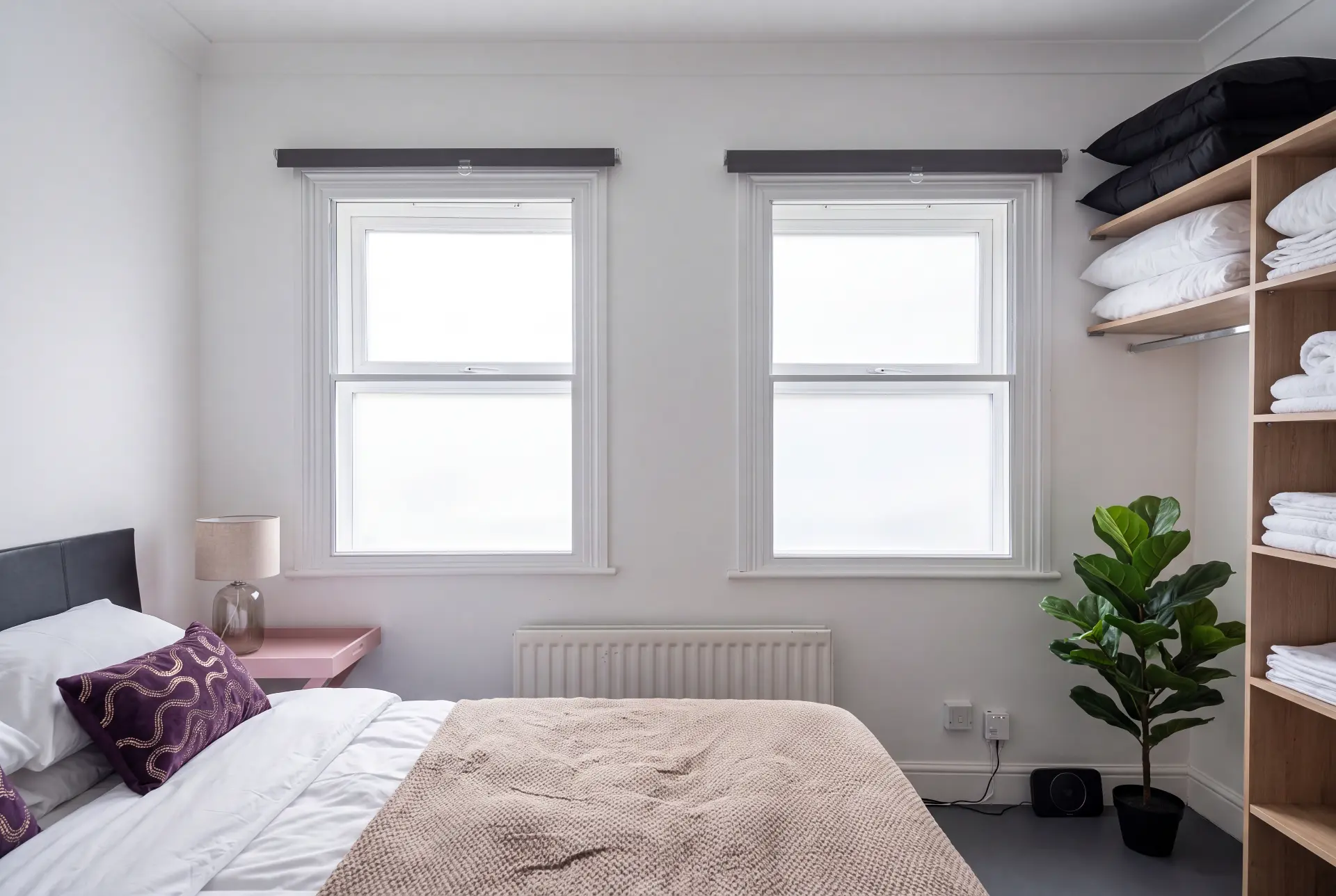 Bedroom sash pair — secondary glazing in Clapham, London Bedroom with two sash windows fitted with discreet secondary glazing