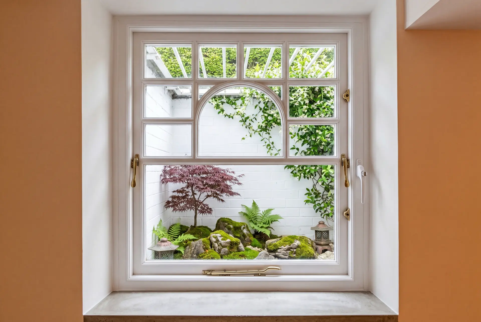Arched courtyard casement — secondary glazing in Chiswick, London Secondary glazing over an arched multi-pane casement window facing a courtyard Japanese garden