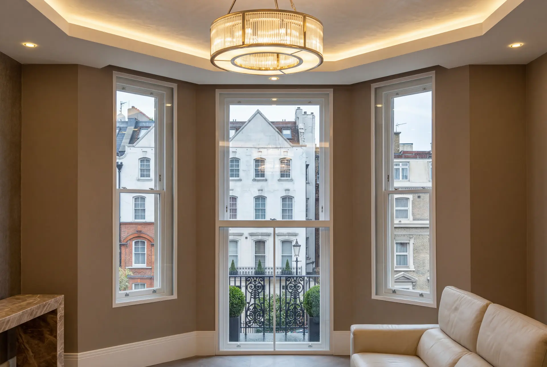 Balcony door bay — secondary glazing in Marylebone, London Angled bay with secondary glazing and a full-height balcony door in a Mayfair reception room