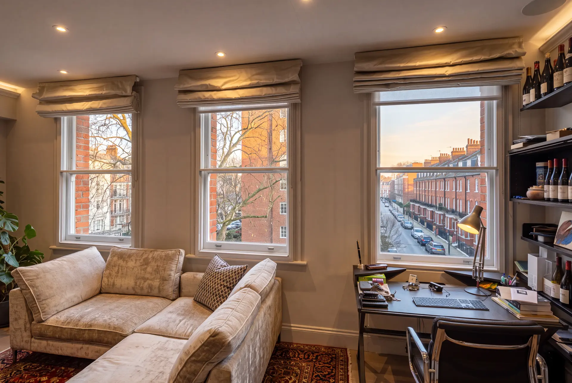 Study, three sashes — secondary glazing in Chelsea, London Study with three sash windows fitted with secondary glazing overlooking a red-brick London street