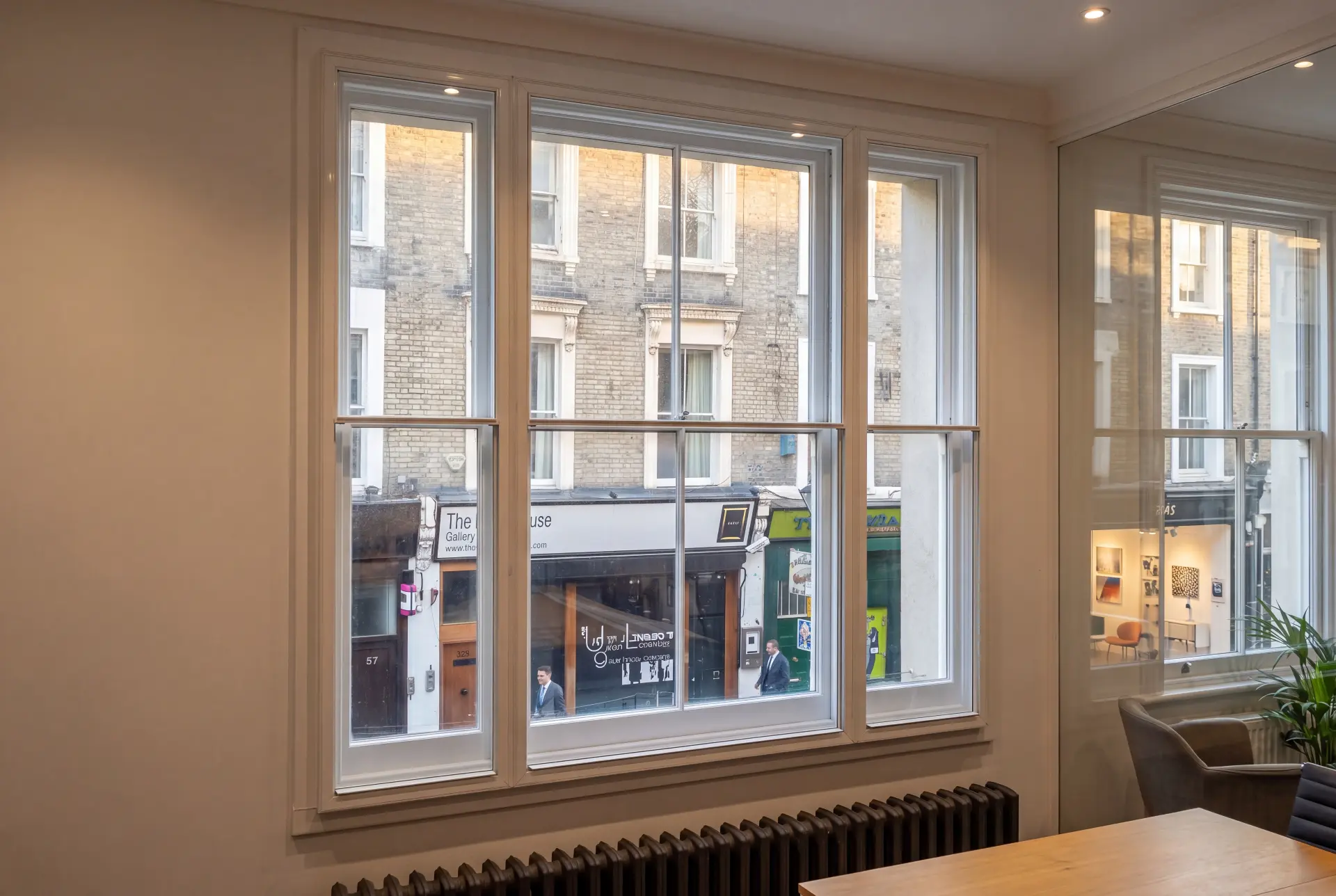 Meeting room frontage — secondary glazing in Soho, London Meeting room with four-panel secondary glazing overlooking a busy London street