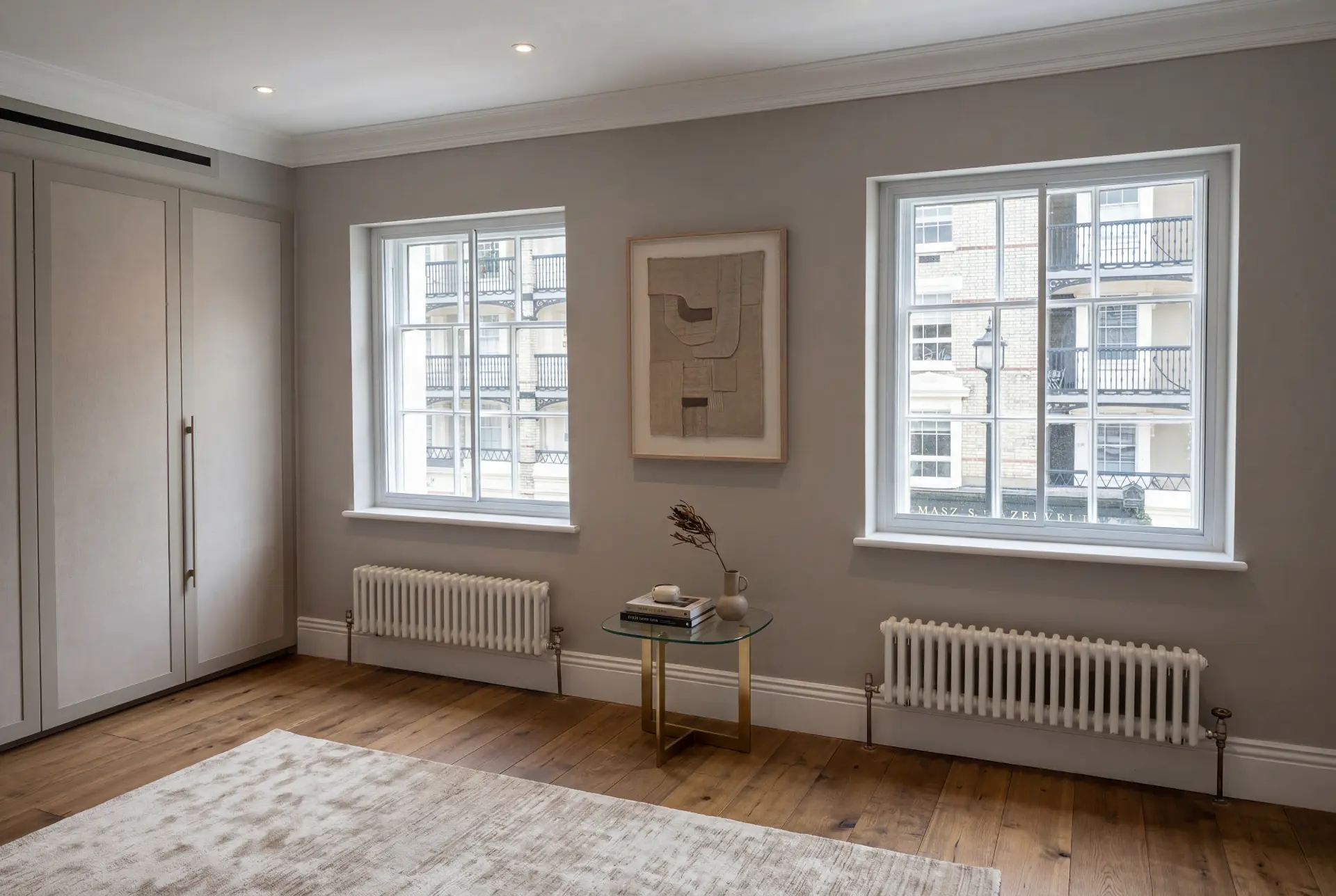 Stucco terrace reception — secondary glazing in Belgravia, London Elegant reception room with secondary glazing on two sash windows overlooking a stucco terrace