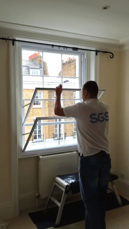 Certified SGS installer working on soundproof window installation
