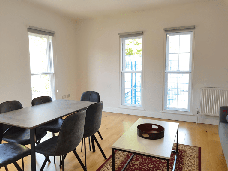 Tall sash living room — secondary glazing in Hampstead, London Hampstead living room with secondary glazing on tall sash windows